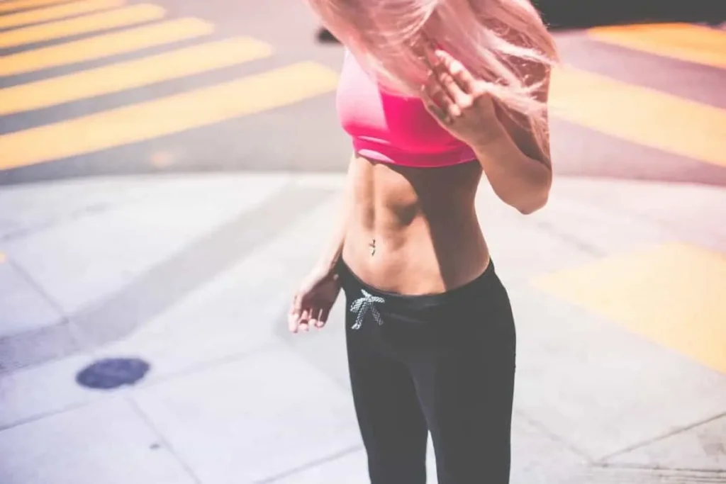 Woman with toned stomach after LA-EMS Body Sculpting Treatment Stonebridge