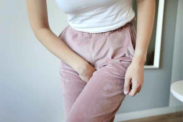 woman running for the toilet because of urinary incontinence Stonebridge